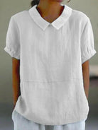 Blue plain short sleeve round neck top by Lumina Vancouver, casual women's shirt, close-up of fabric and neckline.