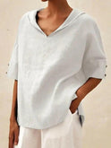 Blue women's casual V-neck blouse by Lumina Wear, featuring a relaxed fit and soft fabric for everyday comfort.