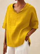 Blue women's casual V-neck shirt by Lumina Vancouver, featuring a comfortable relaxed fit and soft fabric for everyday wear.