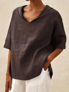 Blue women's casual V-neck shirt by Lumina Vancouver, displayed flat with short sleeves and a relaxed fit.