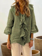 Women’s ruffled casual cotton shirt with 3/4 sleeves by Lumina Vancouver, in blue, featuring stylish ruffle details.