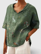 Women's casual V-neck shirt by Lumina Vancouver with woodland and animal print pattern, in green, perfect for everyday wear.
