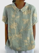 Multicolor women's retro floral art print casual cotton shirt by Lumina Vancouver, displayed in a natural pose.