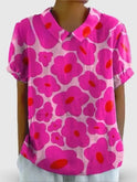 Vibrant pink floral printed women's cotton blouse by Lumina Wear, casual and comfortable for everyday wear.