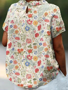 Women's casual cotton shirt with pastoral floral art print by Lumina Vancouver, featuring a relaxed fit and vibrant floral design.