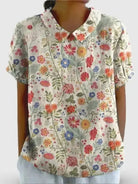 Women's casual cotton shirt with pastoral floral art print by Lumina Vancouver, featuring a relaxed fit and vibrant floral design.