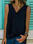 White women's sleeveless V-neck hem split shirt by Lumina Vancouver, casual and stylish for warm weather.