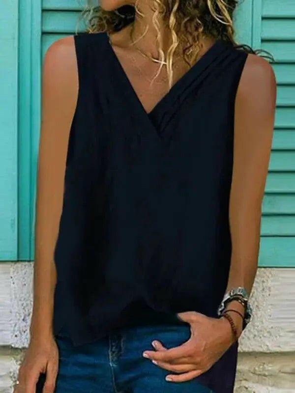White women's sleeveless V-neck hem split shirt by Lumina Vancouver, casual and stylish for warm weather.