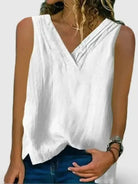 White women's sleeveless V-neck shirt with hem split by Lumina Vancouver, perfect for casual or stylish summer wear.