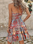 Lumina Vancouver Aulikki halter dress in vibrant tangerine red, featuring a stylish design and flattering fit.