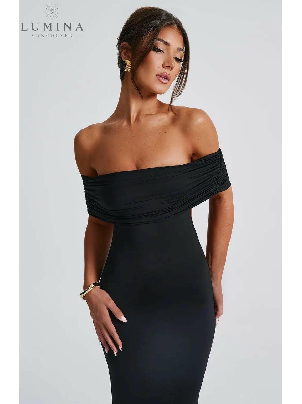 Lumina Vancouver Olympia elegant backless maxi dress for wedding guests, black flowy gown with stylish design and slender fit.
