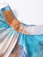 Samarah elegant pleated wedding guest dress by Lumina Vancouver, featuring flowing fabric and sophisticated design.