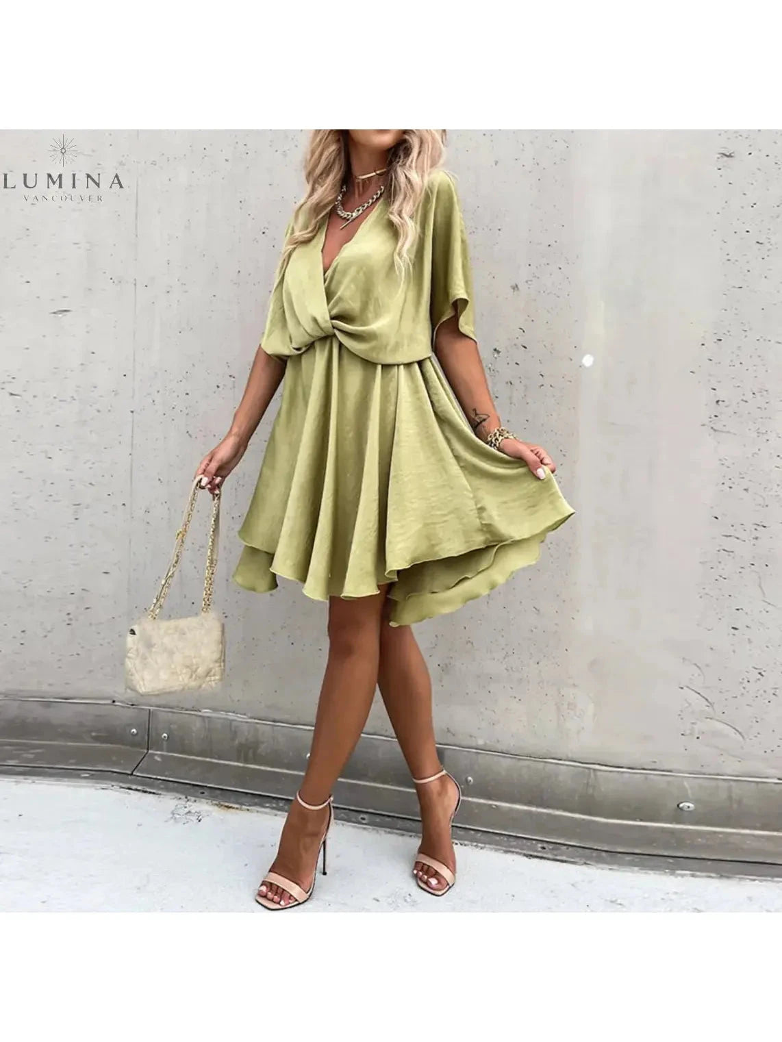 Pink rose elegant wedding guest dress by Lumina Vancouver, showing the flowy fabric and sophisticated design for special occasions.