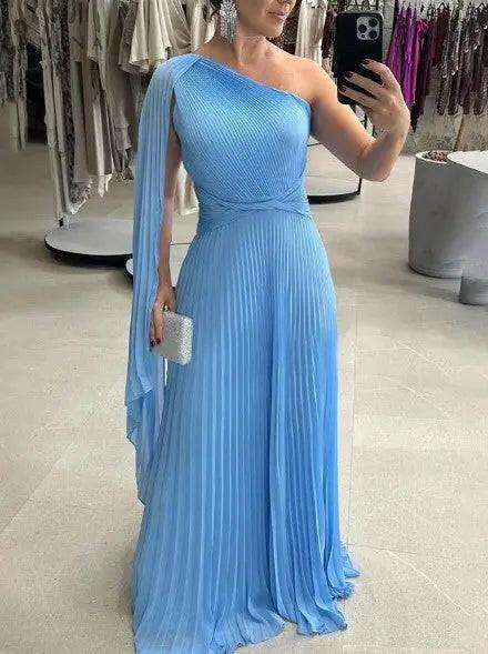 Yellow Dalila off-shoulder pleated maxi dress by Lumina Vancouver, elegant wedding guest dress with flowing fabric.