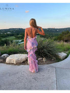 Pink sleeveless long wedding guest dress by Lumina Vancouver, featuring elegant flowy fabric and a flattering fit.
