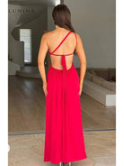 Red Adalyn maxi dress by Lumina Vancouver, elegant wedding guest gown with flowing fabric and stylish design.