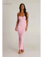 Red Astrid backless maxi dress by Lumina Vancouver, elegant wedding guest gown with flowing silhouette and stylish open back.