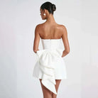 White strapless satin mini dress by Lumina Vancouver, featuring a sleek fit and elegant design, perfect for formal or semi-formal occasions.