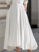 White belted shirt dress with pleated maxi skirt from Lumina Wear, featuring a stylish, flowing design perfect for casual or formal wear.