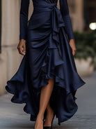Navy blue satin maxi dress with ruffle hem from Lumina Wear, featuring a flowing silhouette and elegant design.