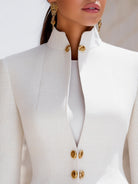 White Lumina Wear Harriet blazer with stand collar, peplum design, gold buttons, tailored fit, perfect for stylish office or casual wear.