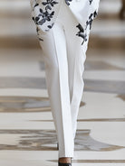 White floral printed pantsuit set by Lumina Wear featuring stylish, lightweight fabric and tailored fit perfect for elegant occasions.