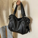 Lumina Wear Lunelle black handbag with spacious interior and versatile strap, stylish for everyday use.