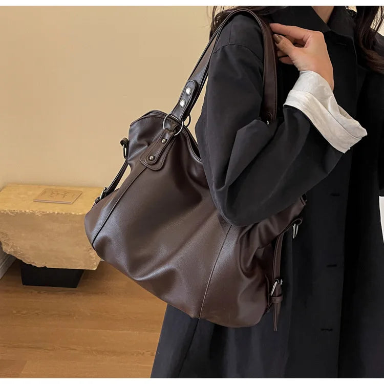 Lumina Wear Lunelle black handbag with spacious interior and versatile strap, stylish accessory for everyday use.