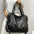 Lumina Wear Lunelle black handbag with spacious interior and versatile strap, perfect for everyday use.