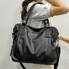 Lumina Wear Lunelle black handbag with spacious interior and versatile strap, perfect for everyday use and stylish outings.