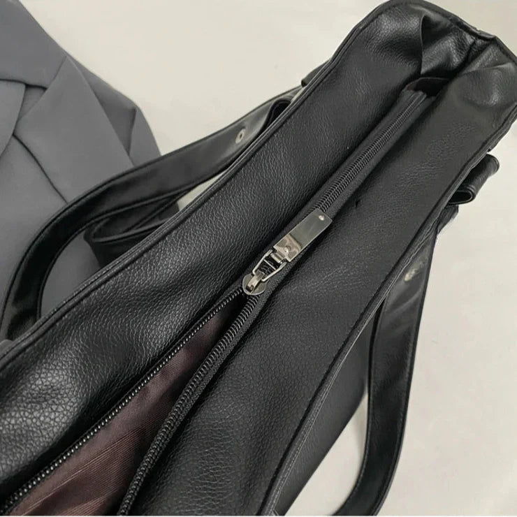 Lumina Wear Lunelle black handbag with spacious interior and versatile strap, perfect for everyday use and stylish occasions.