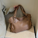 Lumina Wear Lunelle black handbag with spacious interior and versatile strap, stylish and functional for everyday use.