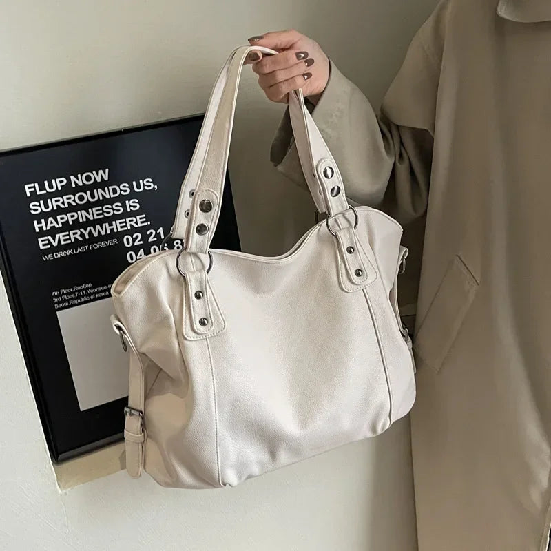 Lumina Wear Lunelle black handbag with spacious interior and versatile strap, stylish accessory for everyday use.