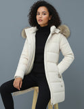 Beige Lydia Lumina Wear longline puffer coat with faux-fur hood, cozy and warm, shown on a model outdoors.