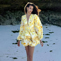 Lumina Wear Lyra floral mini dress with deep V-neck, vibrant yellow color, sleeveless design, fitted silhouette, perfect for summer.