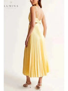 Yellow Madeleine elegant maxi dress by Lumina Vancouver, perfect for wedding guests, shown on a model.
