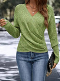 Green Madeline women's top by Lumina Wear featuring a flattering V-neck wrap design and relaxed fit.