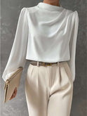 Off-white Lumina Wear Madison relaxed fit blouse with elegant design and timeless appeal, shown on a model.