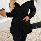 Maisie Lumina Wear cozy black sherpa-lined parka jacket with adjustable fit, warm and stylish for cold weather.