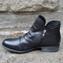 Makayla black leather ankle boots with sleek design, stylish footwear by Lumina Wear, featuring a classic silhouette and smooth finish.