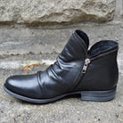 Makayla black leather ankle boots with sleek design, stylish footwear by Lumina Wear, featuring a classic silhouette and smooth finish.