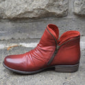 Makayla Lumina black leather ankle boots with sleek design and pointed toe, stylish footwear for women.