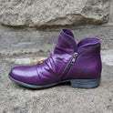 Makayla Lumina black leather ankle boots with sleek design, featuring a pointed toe and low heel for stylish comfort.