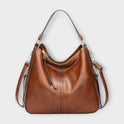 Black Lumina Wear Margaux slouchy hobo handbag with versatile straps, featuring a relaxed, stylish design and spacious interior.