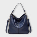 Black Lumina Wear Margaux slouchy hobo handbag with versatile straps, showing its relaxed shape and stylish design.