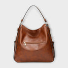 Black Lumina Wear Margaux slouchy hobo bag with versatile straps, showcasing its relaxed style and spacious design.