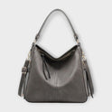 Black Lumina Wear Margaux slouchy hobo handbag with versatile straps, showcasing its relaxed, stylish design and spacious interior.