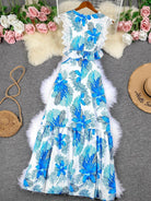 Blue sleeveless lace maxi dress by Lumina Vancouver, Margie style, featuring a trendy, elegant design perfect for summer occasions.
