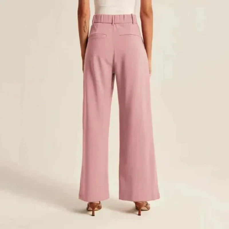 Cream high-waisted, wide-leg women's trousers by Lumina Wear, styled with a relaxed fit and tailored silhouette.