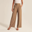 Cream high-waisted wide-leg trousers from Lumina Wear's Marieke collection, tailored for a chic, relaxed fit for women.